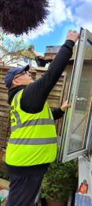 A Locksmith For London technician fixing a broken lock on a UPVC door