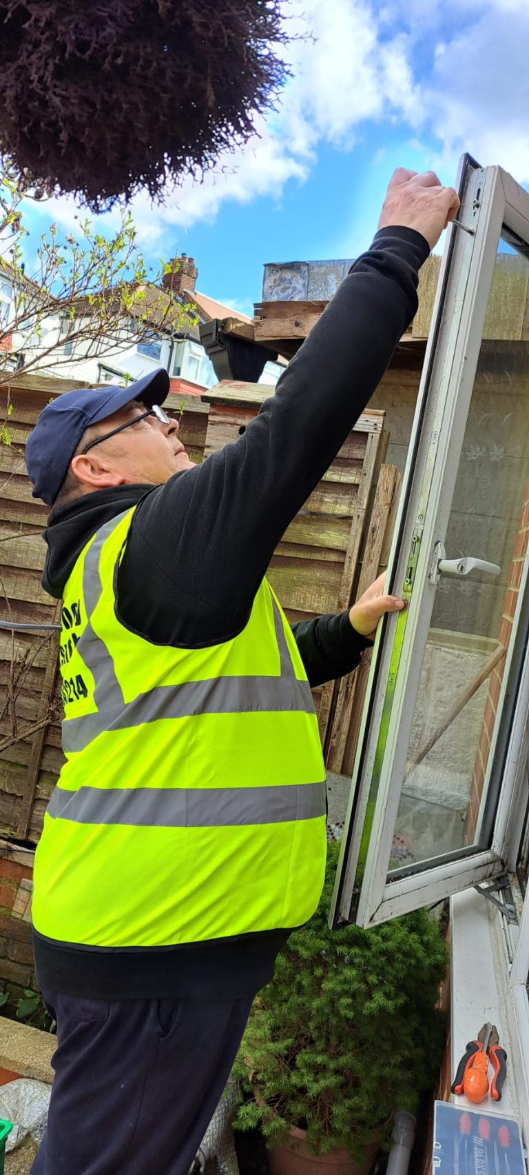 A Locksmith For London technician fixing a broken lock on a UPVC door